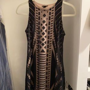 Long black dress. Patterned overlay with nude underneath